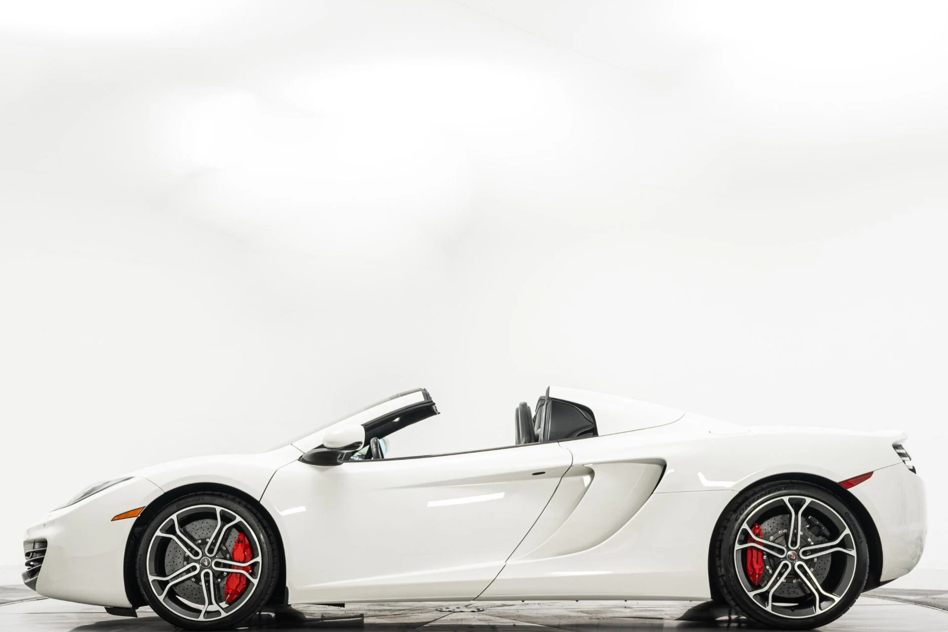 mph005_2853466937_Used_2014_Mc_Laren_MP_4_12_C_Spider_Retractable_Hardtop_616_Horsepower_Low_Miles_1779912312_716b83fc07