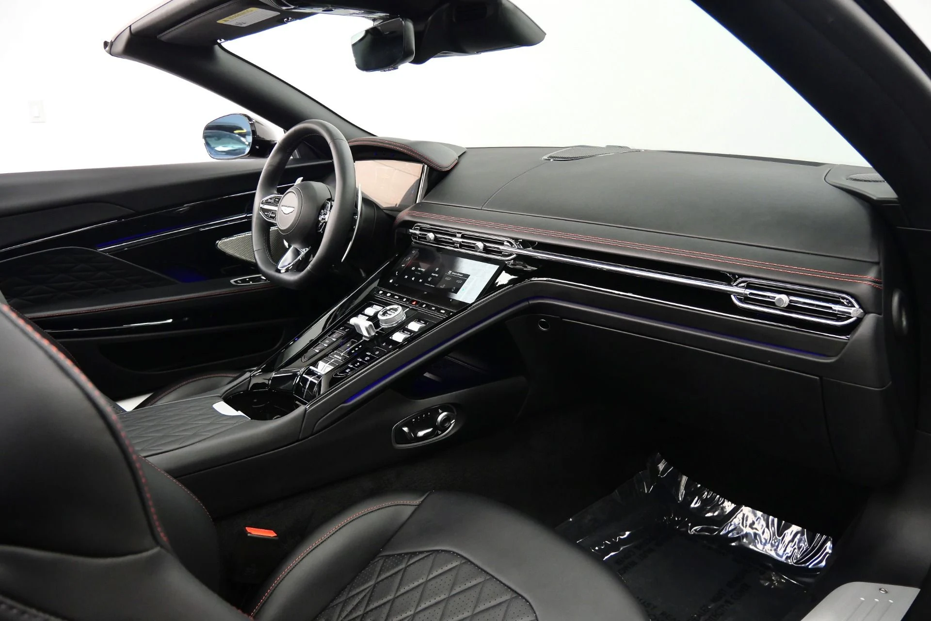 mph013_1922555143_Used_2025_Aston_Martin_DB_12_Volante_Inspire_Sport_Interior_Upper_and_Lower_Black_Packs_1778172034_3ddc5e9470