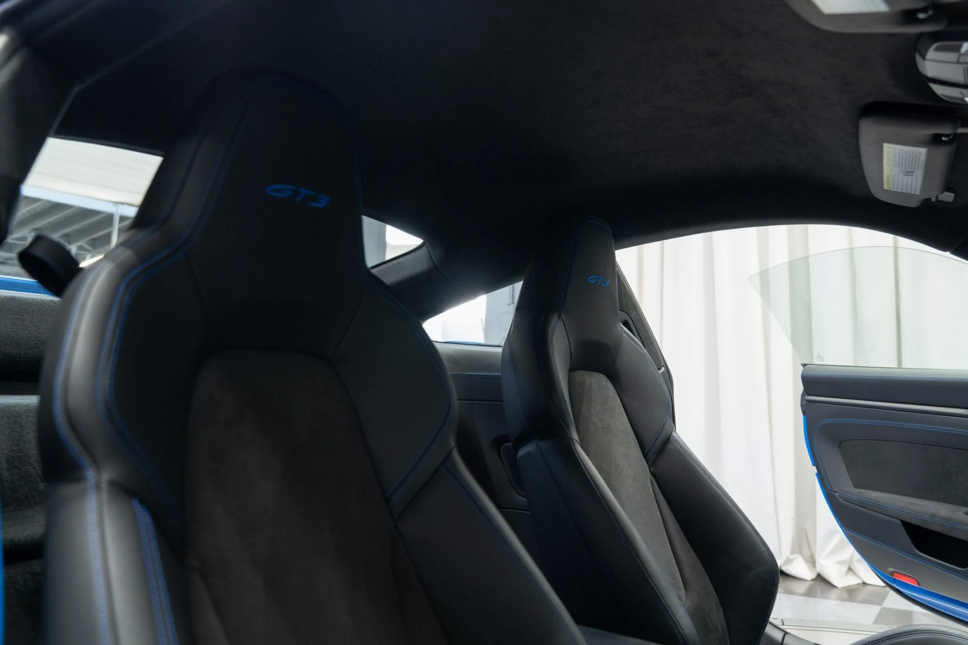 mph022_1697348047_Used_2022_Porsche_911_GT_3_6_Speed_Manual_Low_Miles_Carbon_Roof_Blue_Stitching_1762802258_8266697dcd