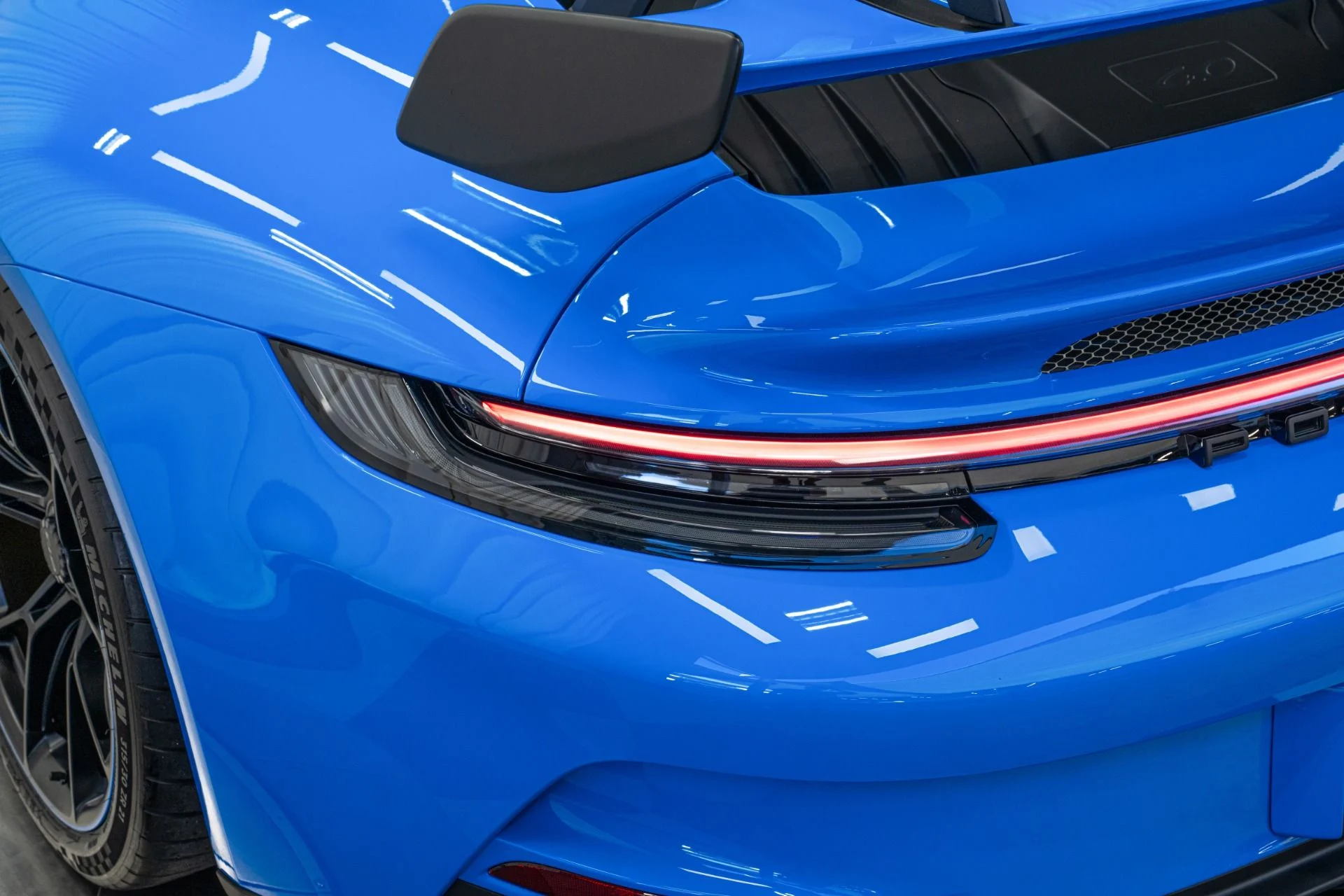 mph033_1862154413_Used_2022_Porsche_911_GT_3_6_Speed_Manual_Low_Miles_Carbon_Roof_Blue_Stitching_1762802258_41ee7ed957