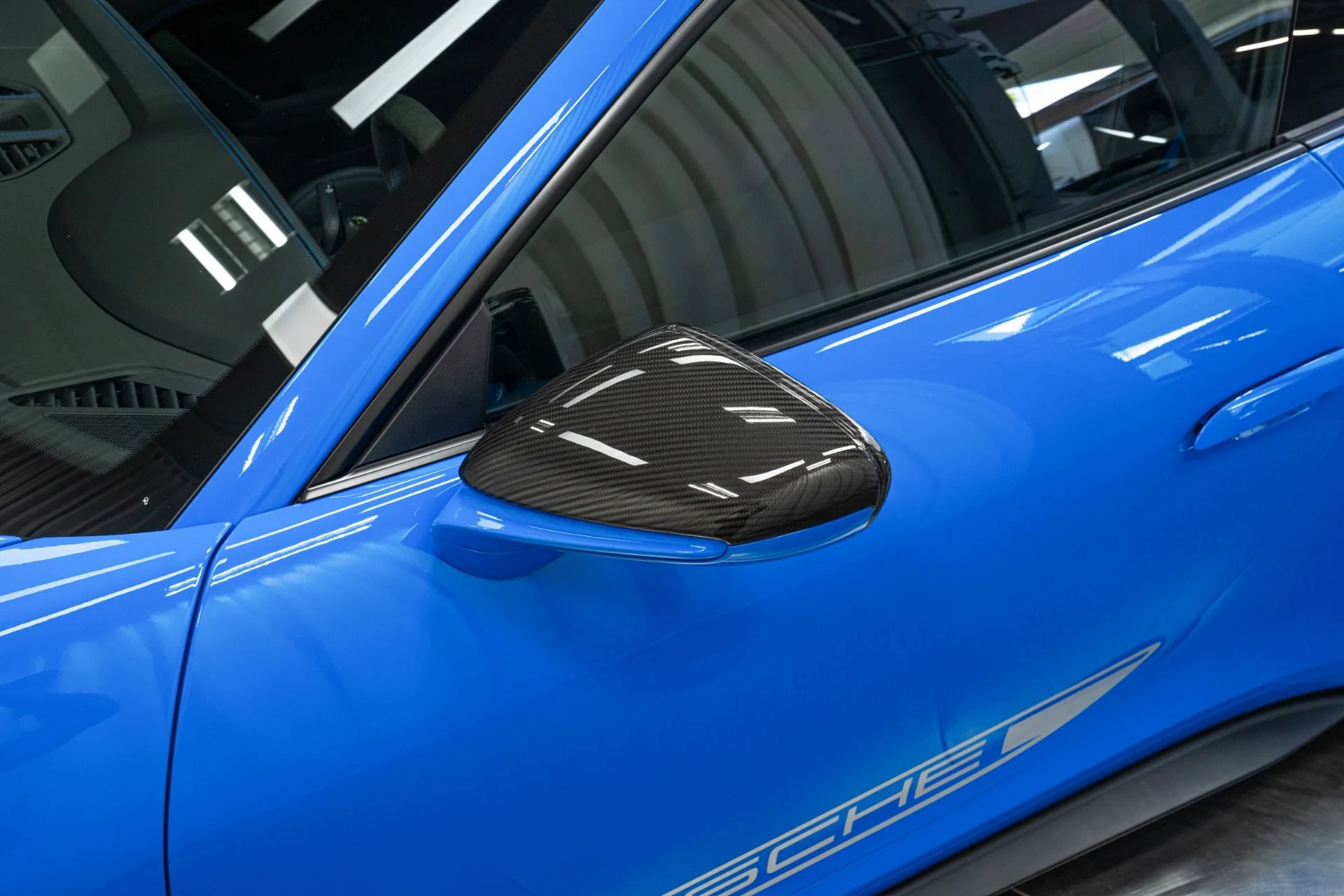 mph034_1054321661_Used_2022_Porsche_911_GT_3_6_Speed_Manual_Low_Miles_Carbon_Roof_Blue_Stitching_1762802258_6de4cc9b17