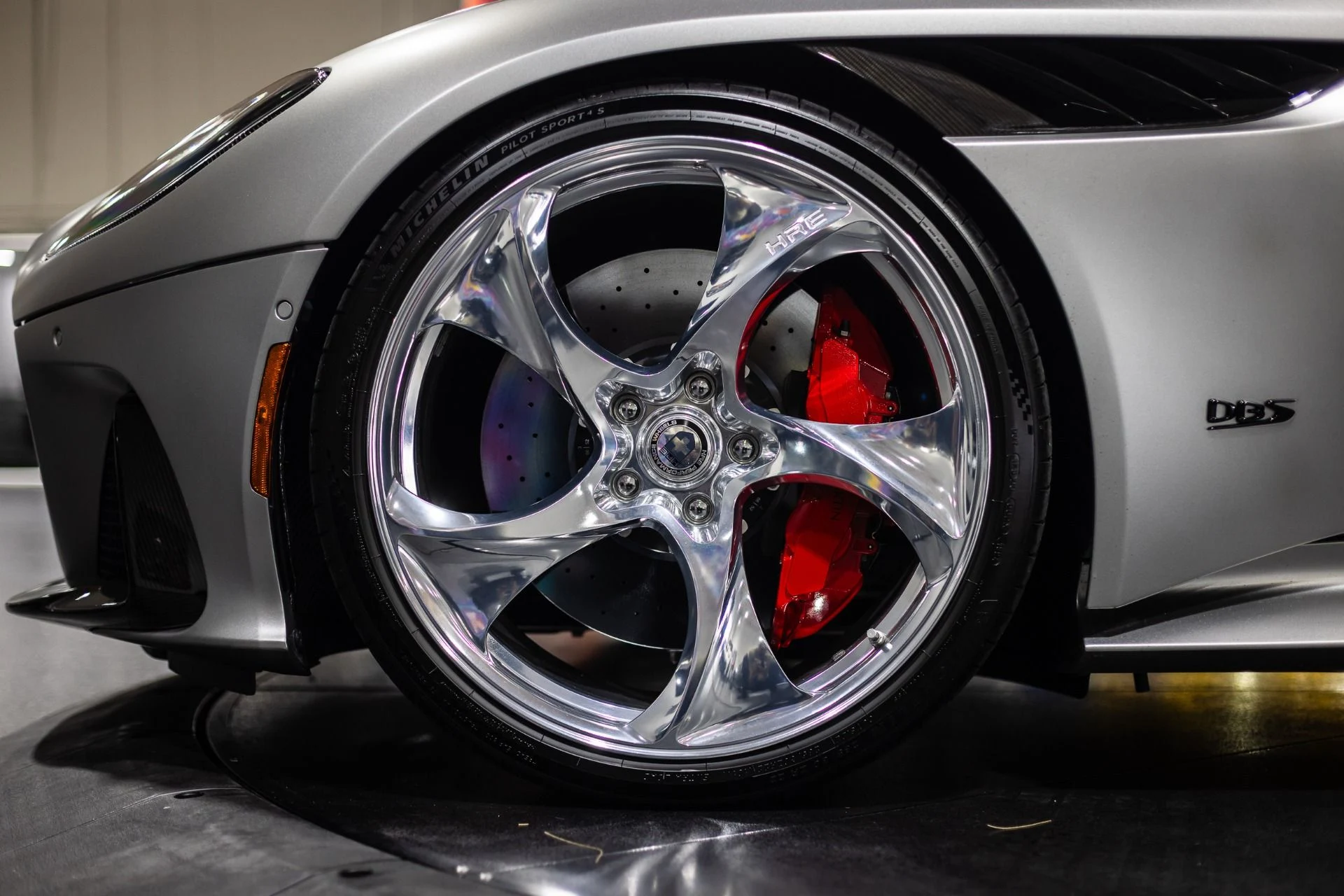 mph034_4157862206_Used_2023_Aston_Martin_DBS_770_Ultimate_Satin_Aluminite_Silver_Paint_Spicy_Red_Interior_HRE_522_M_1773415069_aed8758716