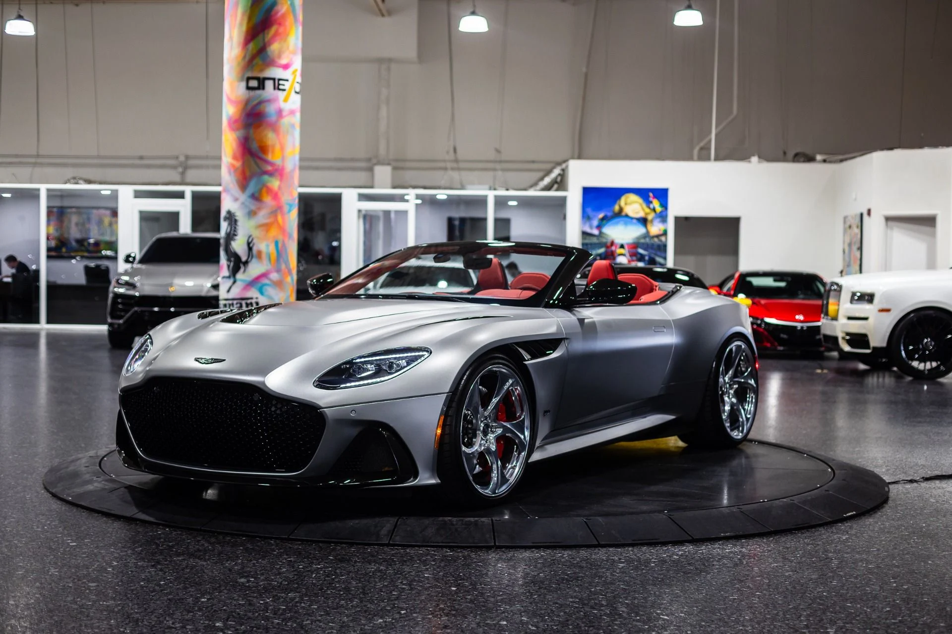 mph059_146694570_Used_2023_Aston_Martin_DBS_770_Ultimate_Satin_Aluminite_Silver_Paint_Spicy_Red_Interior_HRE_522_M_1773368429_d4f7aaeb06