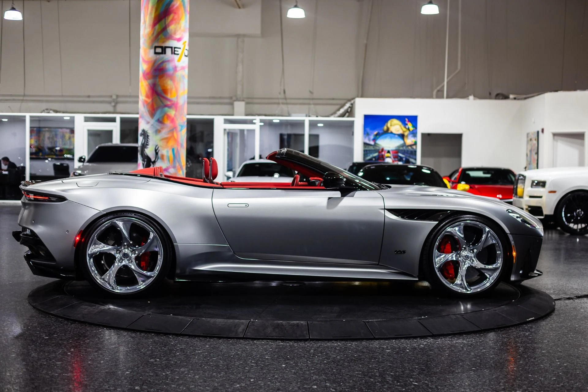 mph062_3142620208_Used_2023_Aston_Martin_DBS_770_Ultimate_Satin_Aluminite_Silver_Paint_Spicy_Red_Interior_HRE_522_M_1773368429_3fe0ebbc68